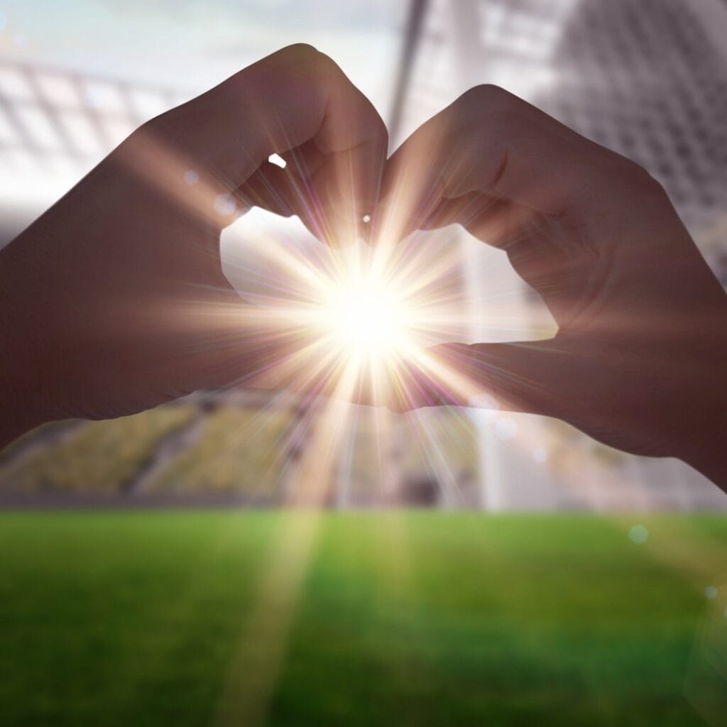 Composite image of woman making heart shape with hands